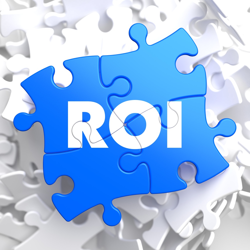 ROI - Return Of Investment - Written on Blue Puzzle Pieces. Business Concept..jpeg