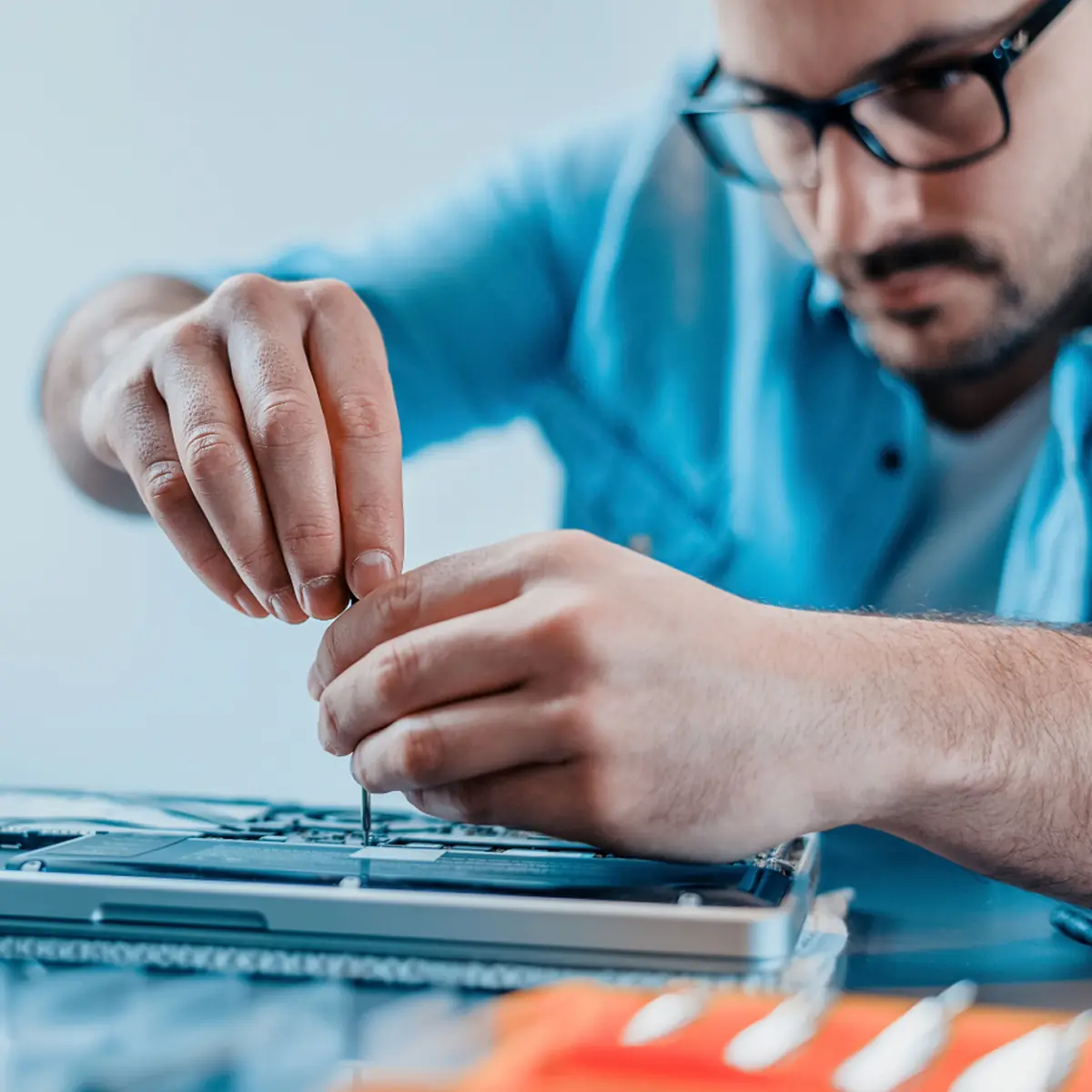 An InfinIT technician configuring network equipment at a Richfield small business location.