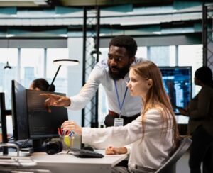 infinIT support team helping employee with technical problem demonstrating responsive IT support in Cleveland office